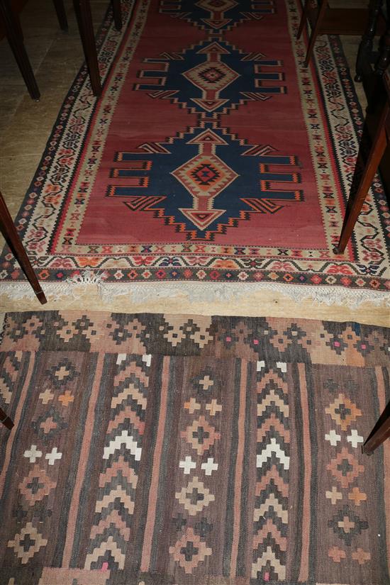 A Turkish red ground polychrome kilim and a smaller kilim